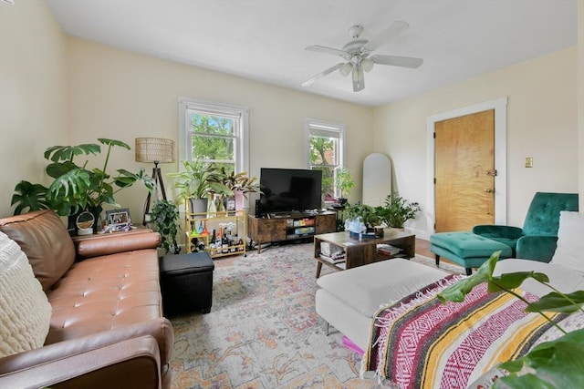 living area with ceiling fan