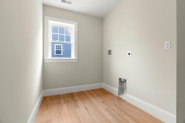 laundry area featuring washer hookup, hookup for an electric dryer, laundry area, light wood-type flooring, and baseboards