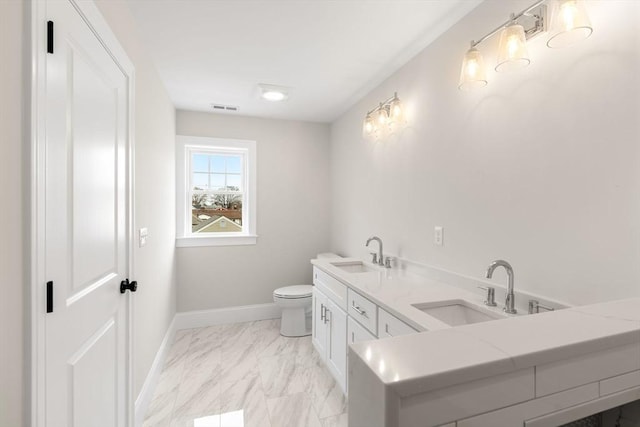 full bath featuring visible vents, a sink, marble finish floor, and toilet