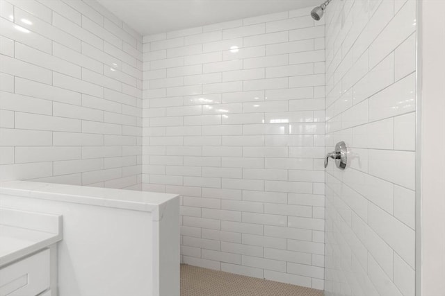 full bath featuring a tile shower