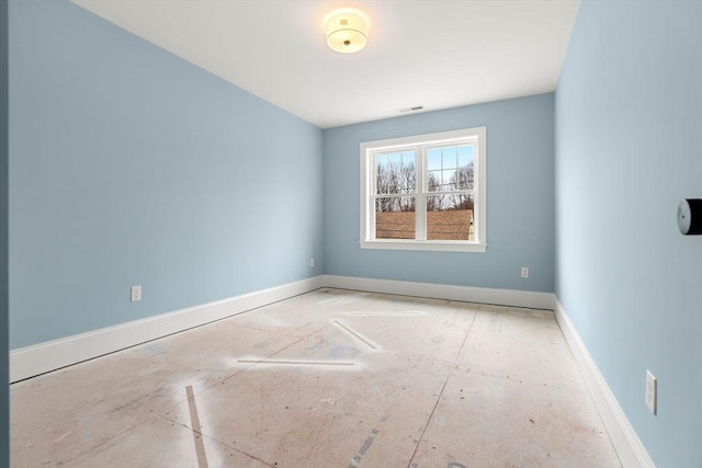 empty room with baseboards and visible vents