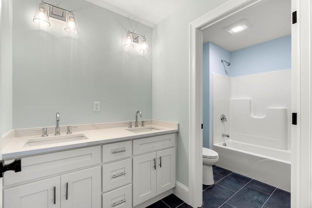 bathroom featuring tile patterned flooring, a sink, shower / bathing tub combination, and toilet