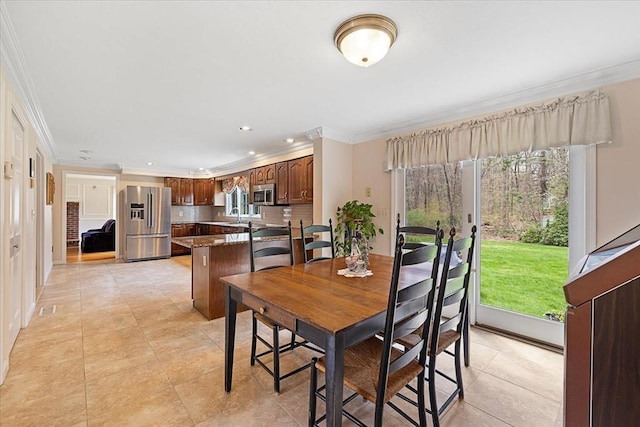 dining space with recessed lighting, ornamental molding, and plenty of natural light