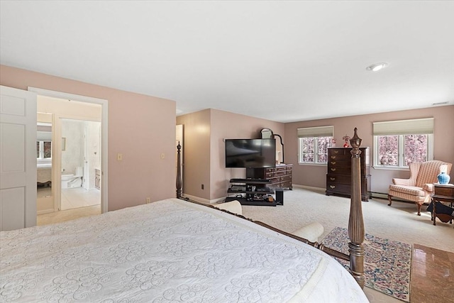 carpeted bedroom featuring baseboards
