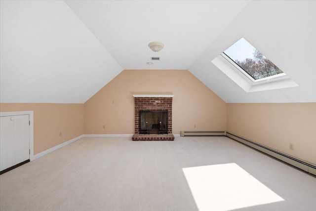 bonus room featuring carpet floors, visible vents, vaulted ceiling with skylight, and a baseboard radiator