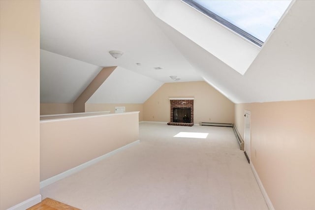 bonus room featuring baseboards, carpet flooring, and vaulted ceiling with skylight