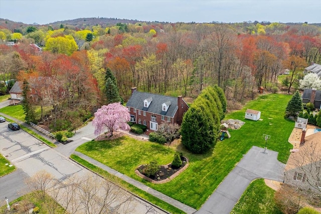 bird's eye view featuring a forest view