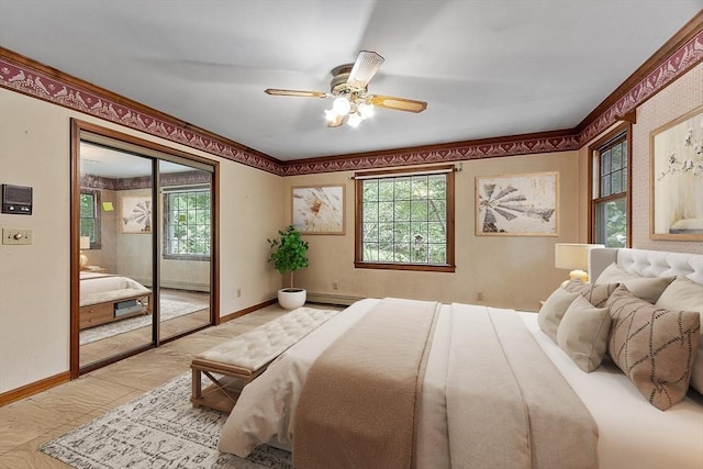 bedroom with a baseboard heating unit, access to outside, a ceiling fan, and baseboards