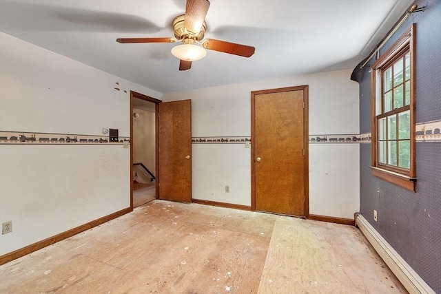 unfurnished bedroom with ceiling fan, baseboards, and baseboard heating