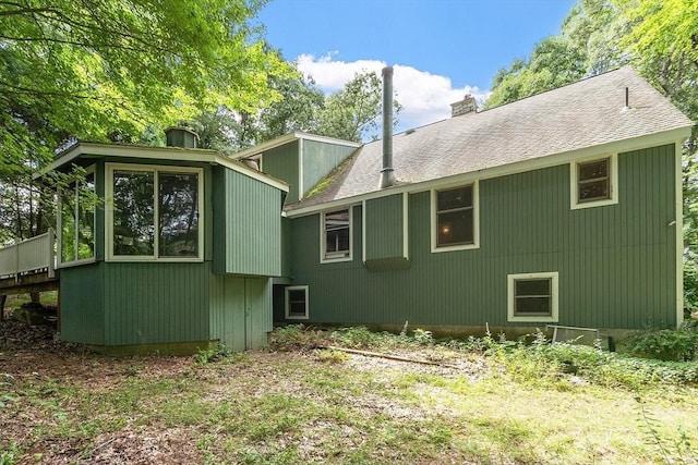 rear view of house with a chimney