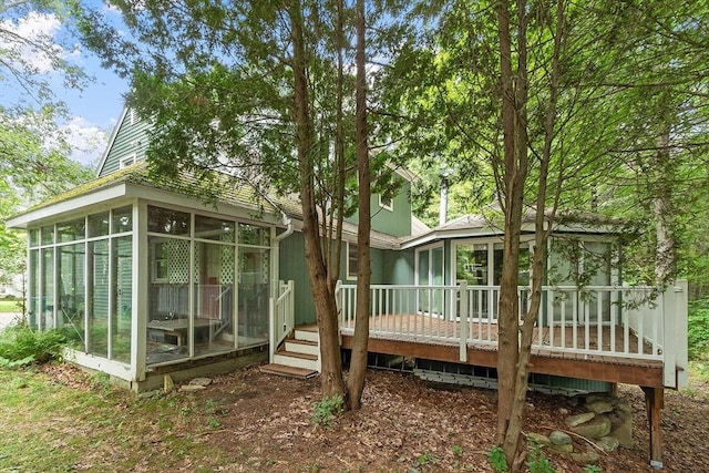 back of house with a sunroom