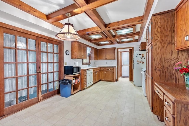 kitchen with brown cabinets, light floors, white appliances, coffered ceiling, and beamed ceiling