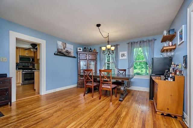 110 Middlefield Rd, Chester, MA 01011 - dining room featuring light wood-style floors, a chandelier, and a ceiling fan