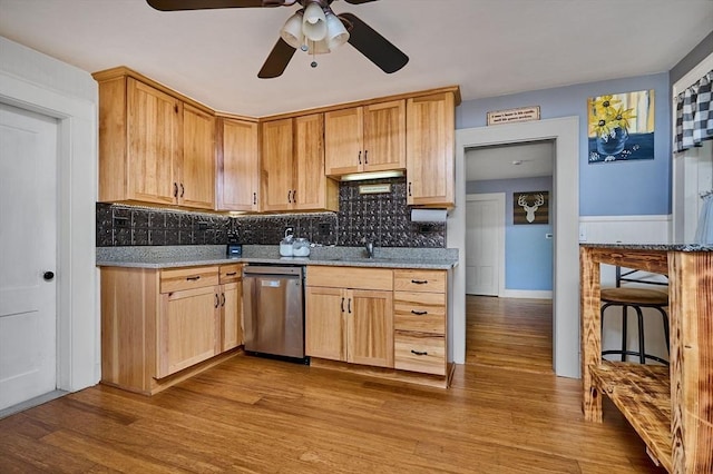 110 Middlefield Rd, Chester, MA 01011 - kitchen with stainless steel dishwasher, a ceiling fan, decorative backsplash, wood finished floors, and light stone countertops