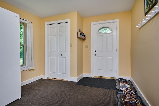 110 Middlefield Rd, Chester, MA 01011 - foyer featuring dark colored carpet and baseboards