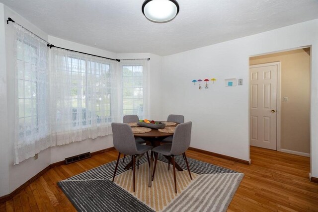 25 Church St Unit 2, Weymouth, MA 02189 - dining room with baseboards and wood finished floors