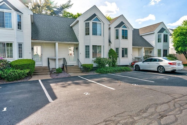 25 Church St Unit 2, Weymouth, MA 02189 - view of front facade featuring uncovered parking and roof with shingles