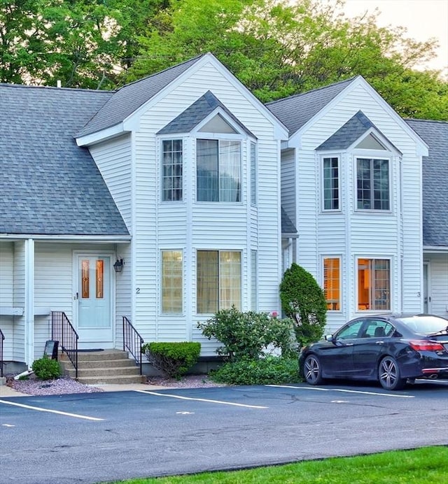 25 Church St Unit 2, Weymouth, MA 02189 - view of front of house with a shingled roof and uncovered parking