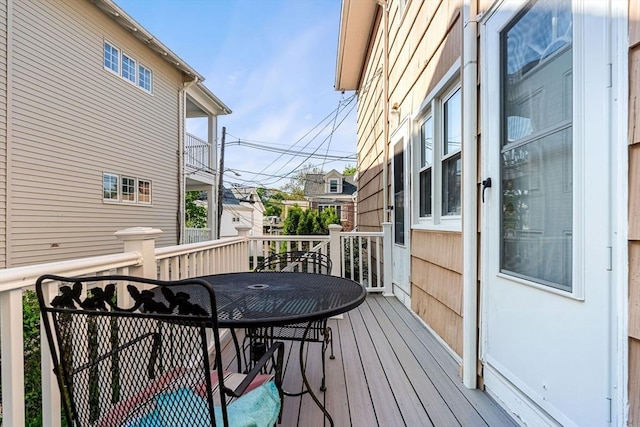 wooden deck with outdoor dining area