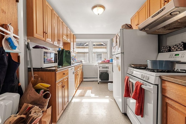 kitchen featuring white appliances, under cabinet range hood, baseboard heating, light flooring, and dark countertops