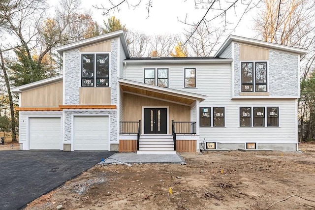 view of front facade with a porch and a garage