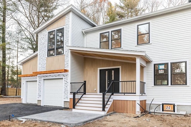 view of front of property featuring a garage