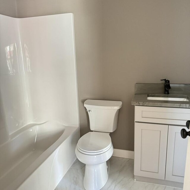 full bathroom featuring bathtub / shower combination, vanity, and toilet