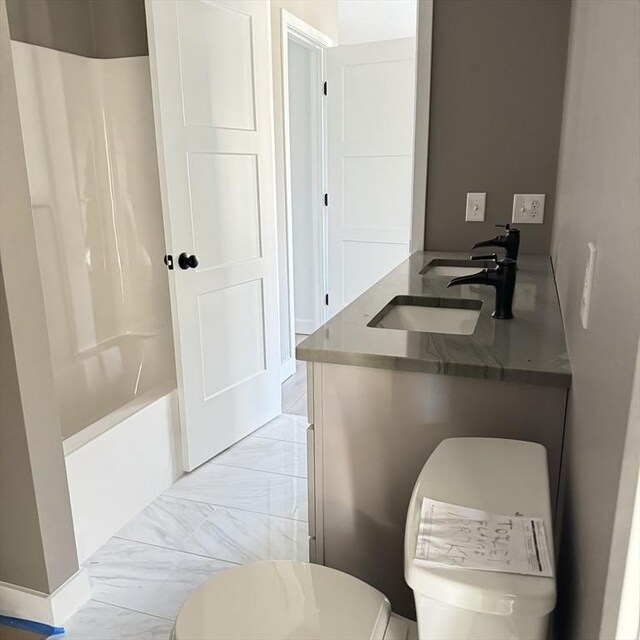 kitchen featuring white cabinetry, sink, and stainless steel appliances