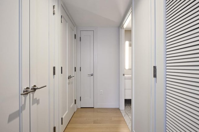 hallway with light wood-type flooring