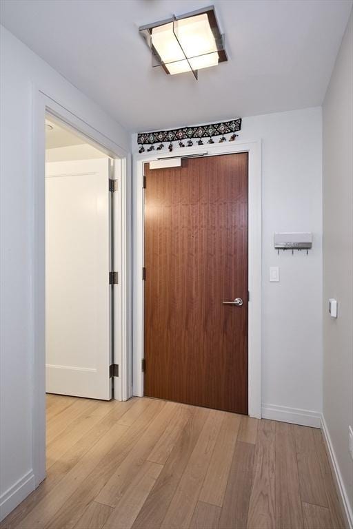 corridor featuring light wood-type flooring