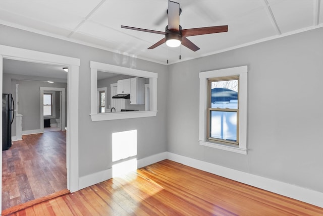 empty room featuring wood-type flooring and ceiling fan