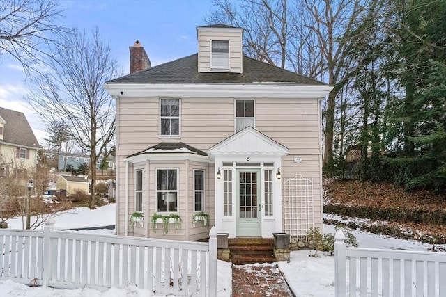 view of snow covered house