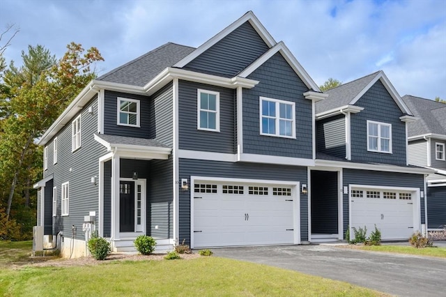 20 Howland Trl Unit 10, Hanson, MA 02341 - view of front of house with a garage, driveway, and a front yard