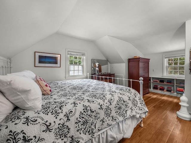 125 Grove St, Norwell, MA 02061 - bedroom with wood finished floors, vaulted ceiling, and multiple windows