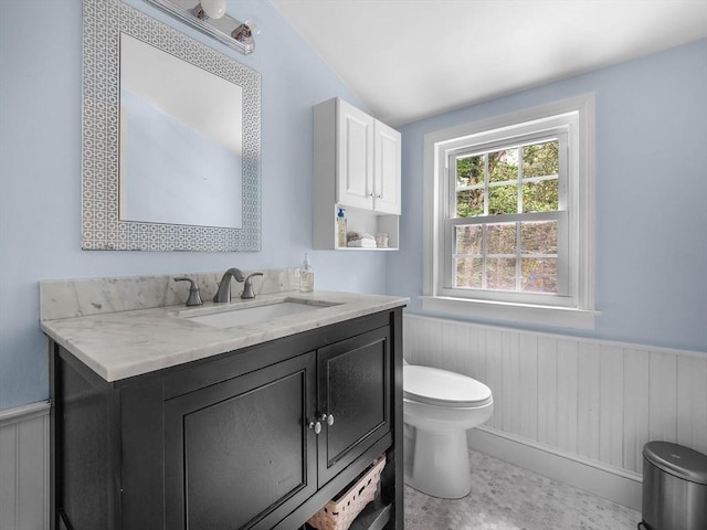 125 Grove St, Norwell, MA 02061 - bathroom featuring a wainscoted wall, vanity, lofted ceiling, and wooden walls