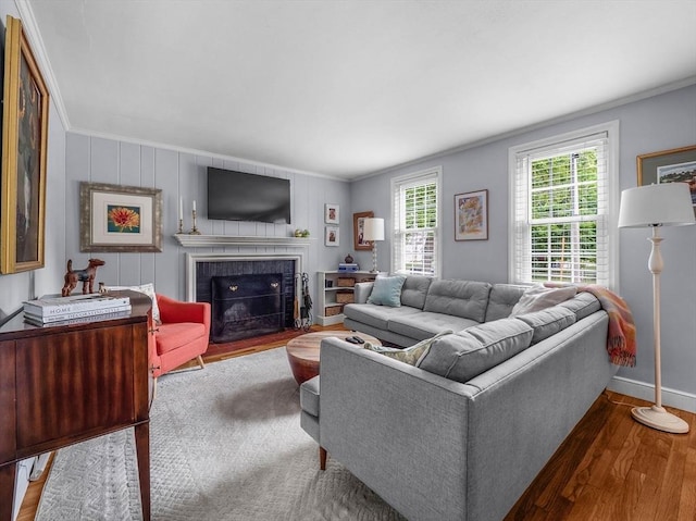 125 Grove St, Norwell, MA 02061 - living area with wood finished floors, ornamental molding, and a tiled fireplace