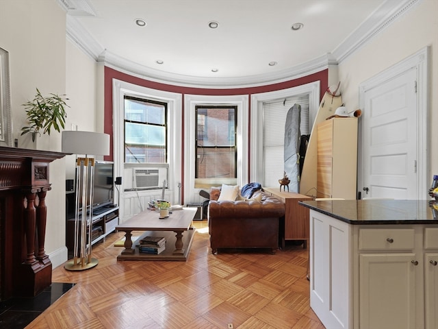 living room featuring cooling unit, crown molding, and light parquet floors