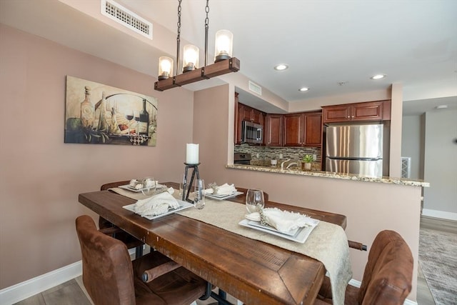 dining room with light wood-type flooring