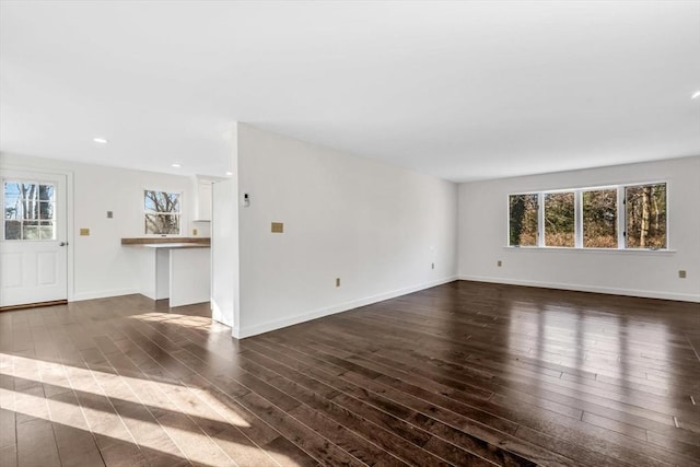 506 Woods Hole Rd, Falmouth, MA 02543 - unfurnished living room with dark wood finished floors, recessed lighting, and baseboards