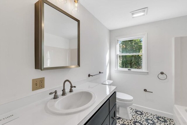 506 Woods Hole Rd, Falmouth, MA 02543 - full bathroom featuring vanity, toilet, baseboards, and tile patterned flooring