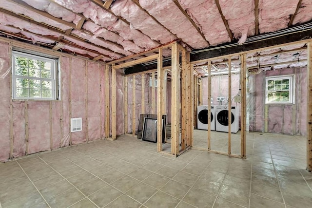 506 Woods Hole Rd, Falmouth, MA 02543 - below grade area featuring washing machine and dryer, healthy amount of natural light, and tile patterned flooring