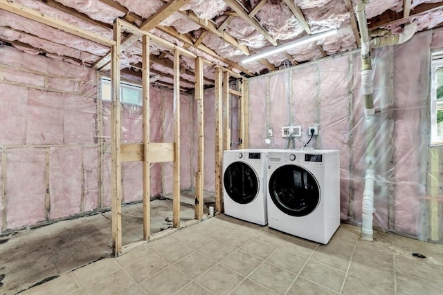 506 Woods Hole Rd, Falmouth, MA 02543 - laundry area with washer and clothes dryer and tile patterned flooring