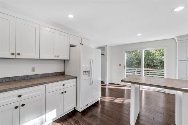 506 Woods Hole Rd, Falmouth, MA 02543 - kitchen featuring white fridge with ice dispenser, dark wood-type flooring, dark countertops, and recessed lighting
