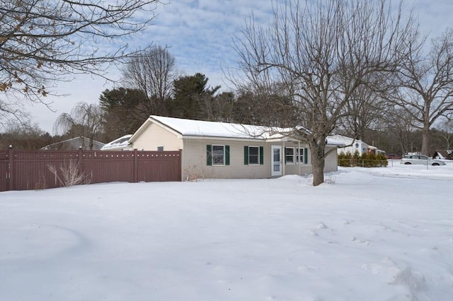 view of front of home featuring fence