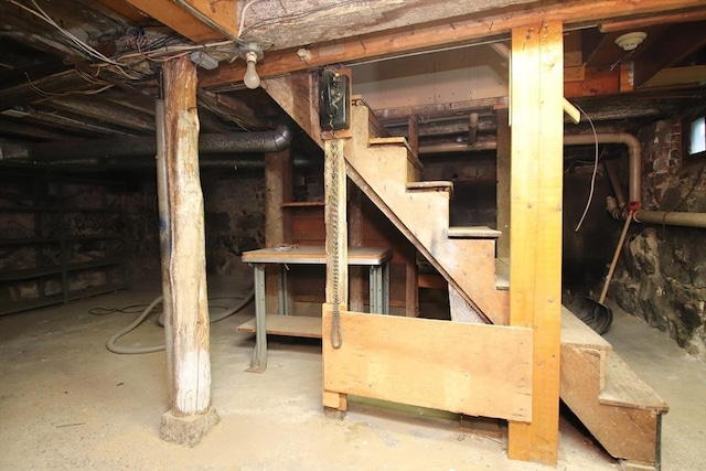 unfinished basement with stairway