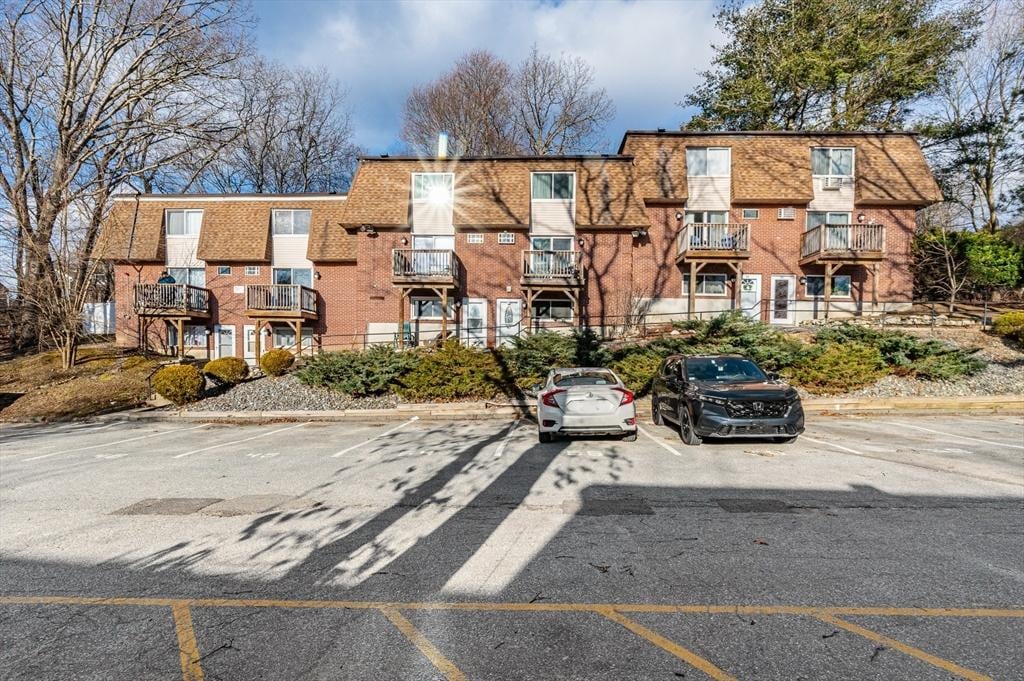645 Robbins Ave Unit 55, Dracut, MA 01826 - view of apartment building / complex with uncovered parking