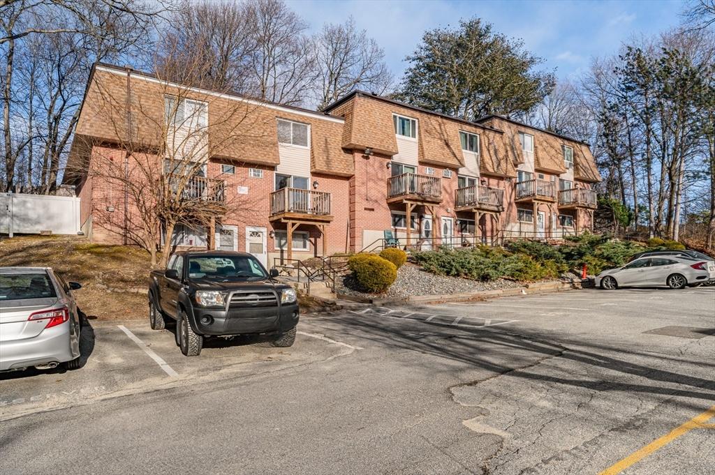 645 Robbins Ave Unit 55, Dracut, MA 01826 - view of apartment building / complex with uncovered parking