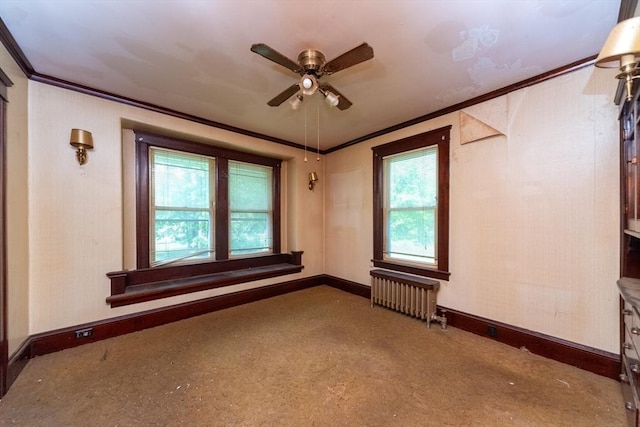 spare room with radiator, ornamental molding, ceiling fan, baseboards, and carpet floors