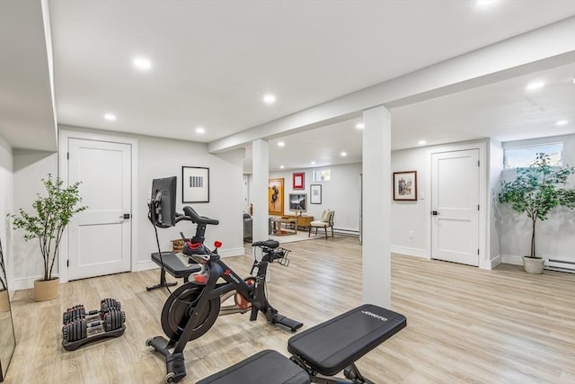 workout room featuring light wood-type flooring