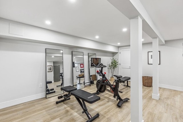 workout area featuring light wood-type flooring